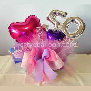 Composizione centrotavola con Palloncini per compleanno 50 anni rosa
